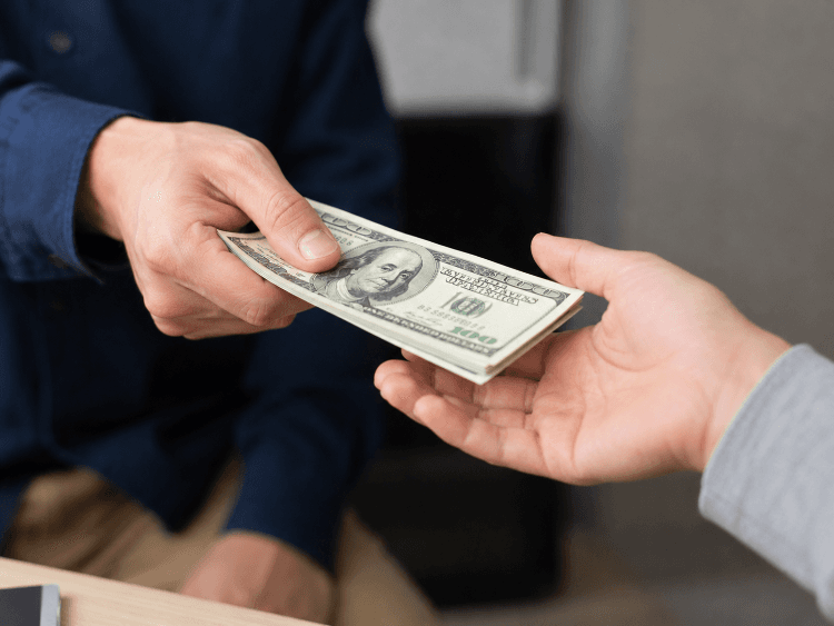 Hands exchanging cash